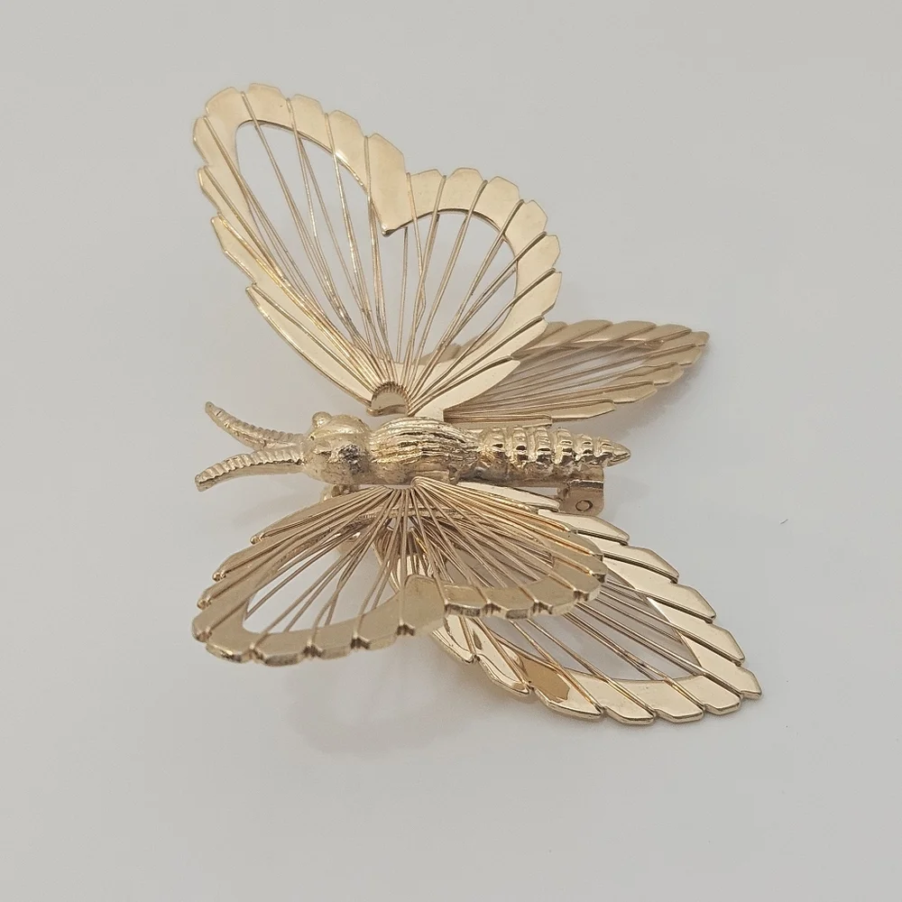 Vintage Monet gold tone butterfly brooch signed